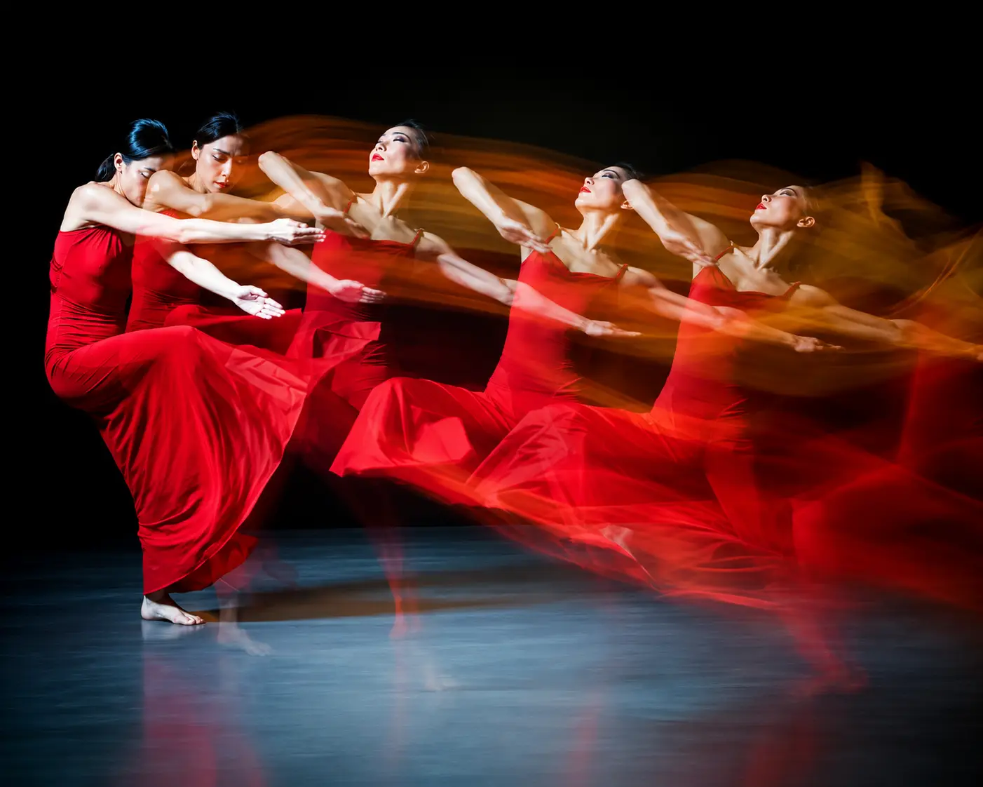 Professional dancers refining choreography in a rehearsal studio
