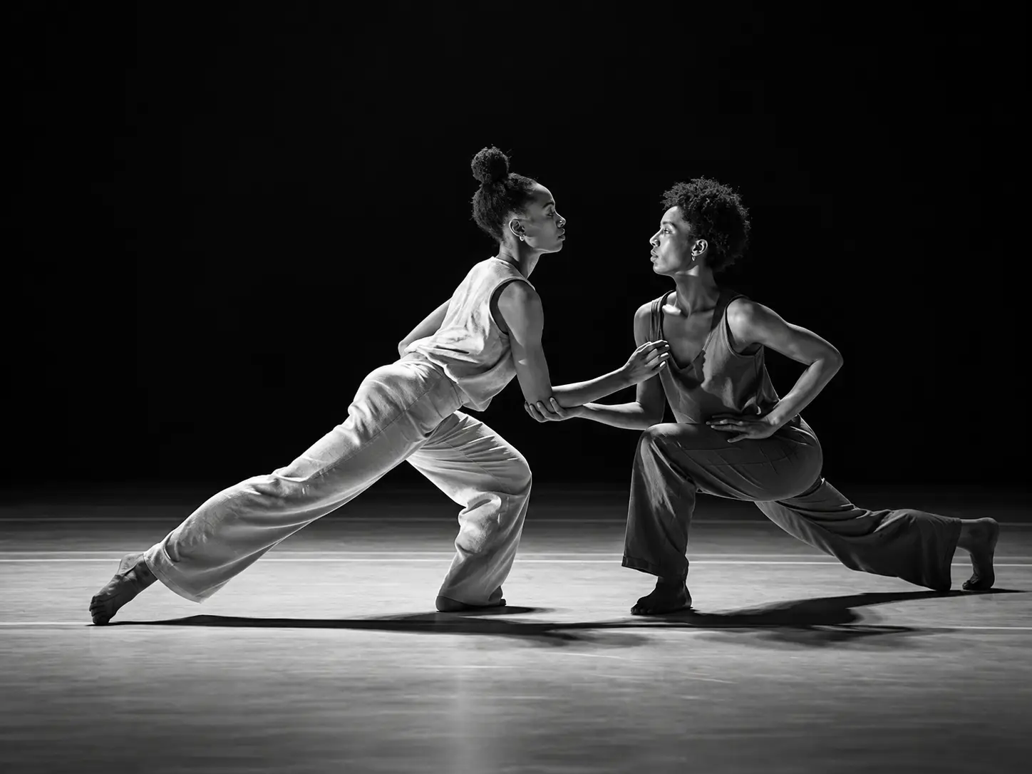 Contemporary dance ensemble in sculptural poses
