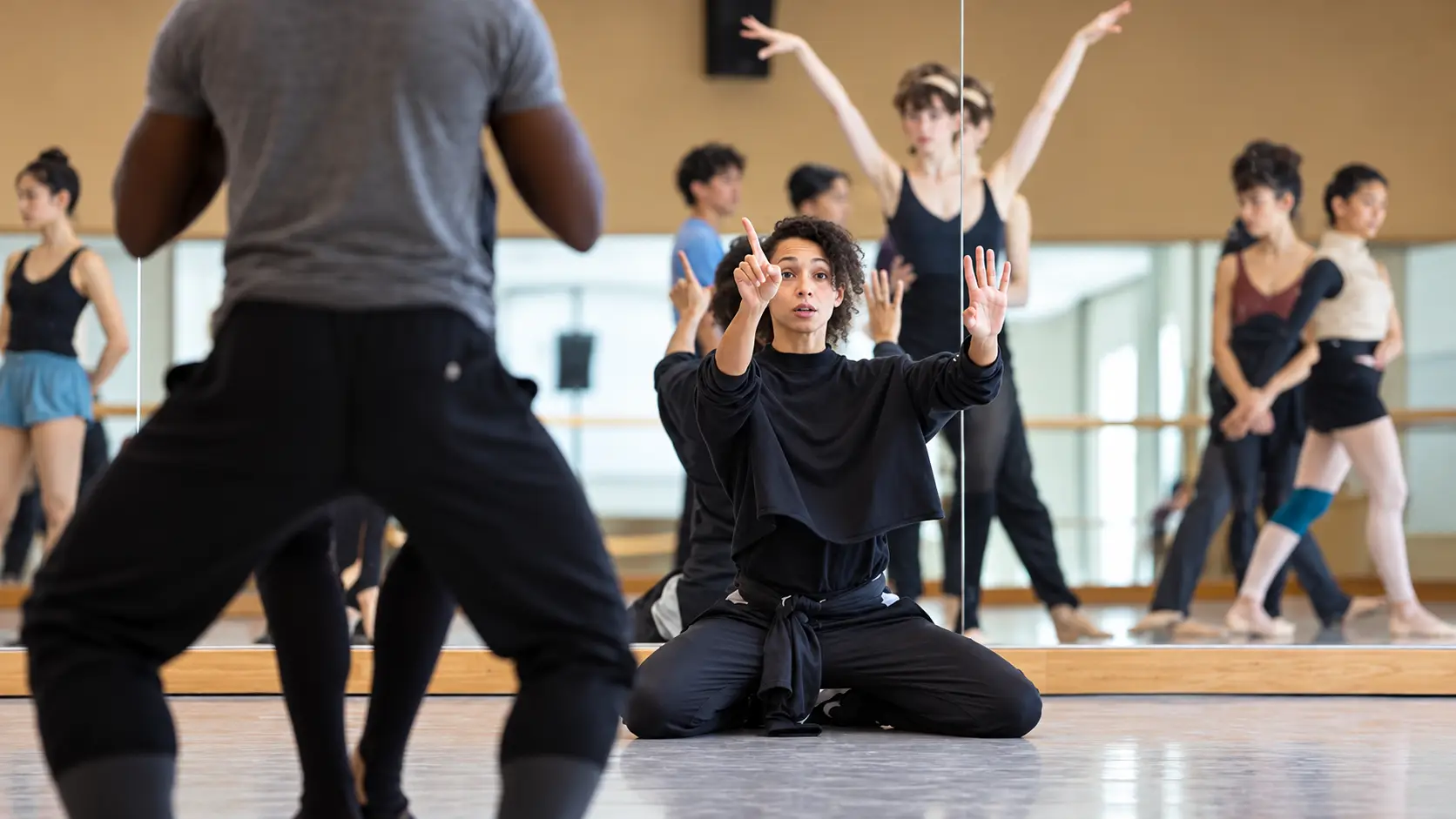 Elegant ballroom filled with guests and a central performance space